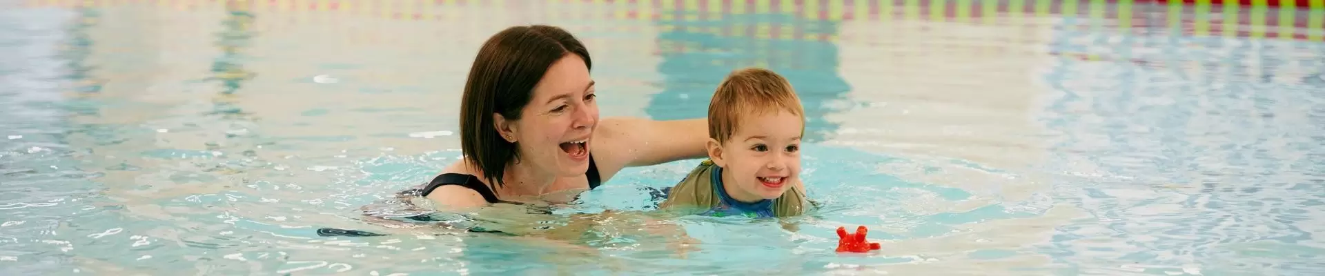 Woman and baby in pool