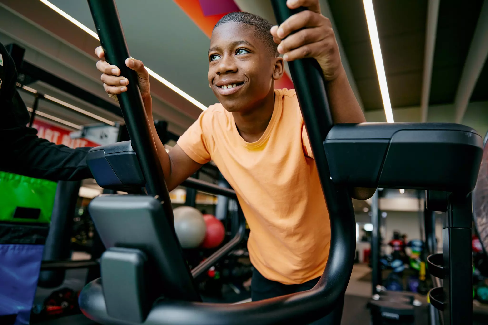 Boy using crosstrainer