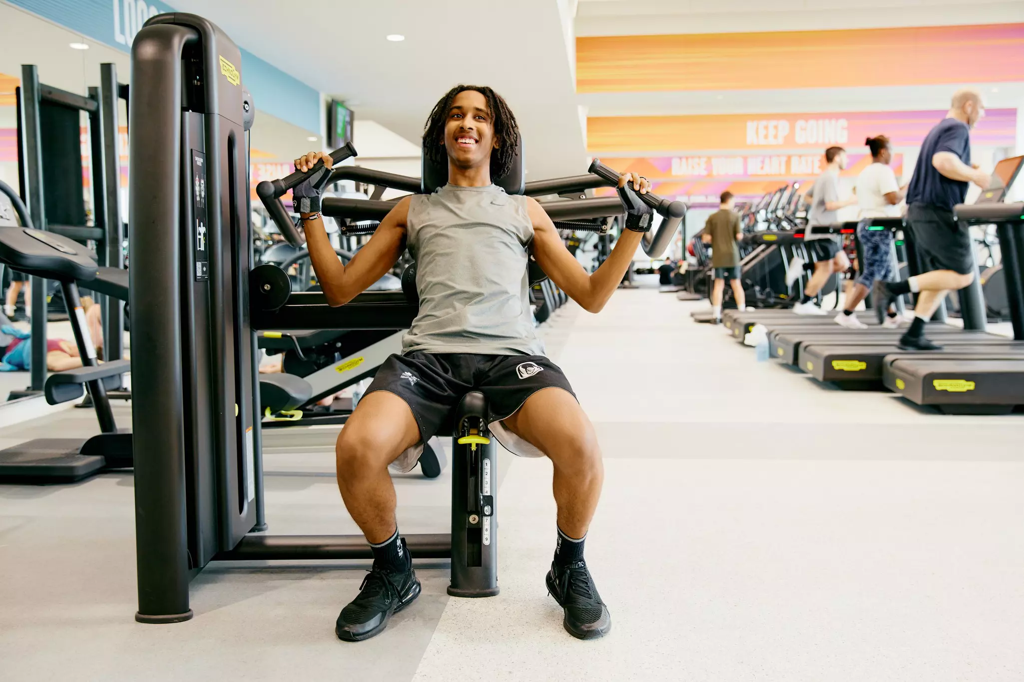 Boy using resistance machine