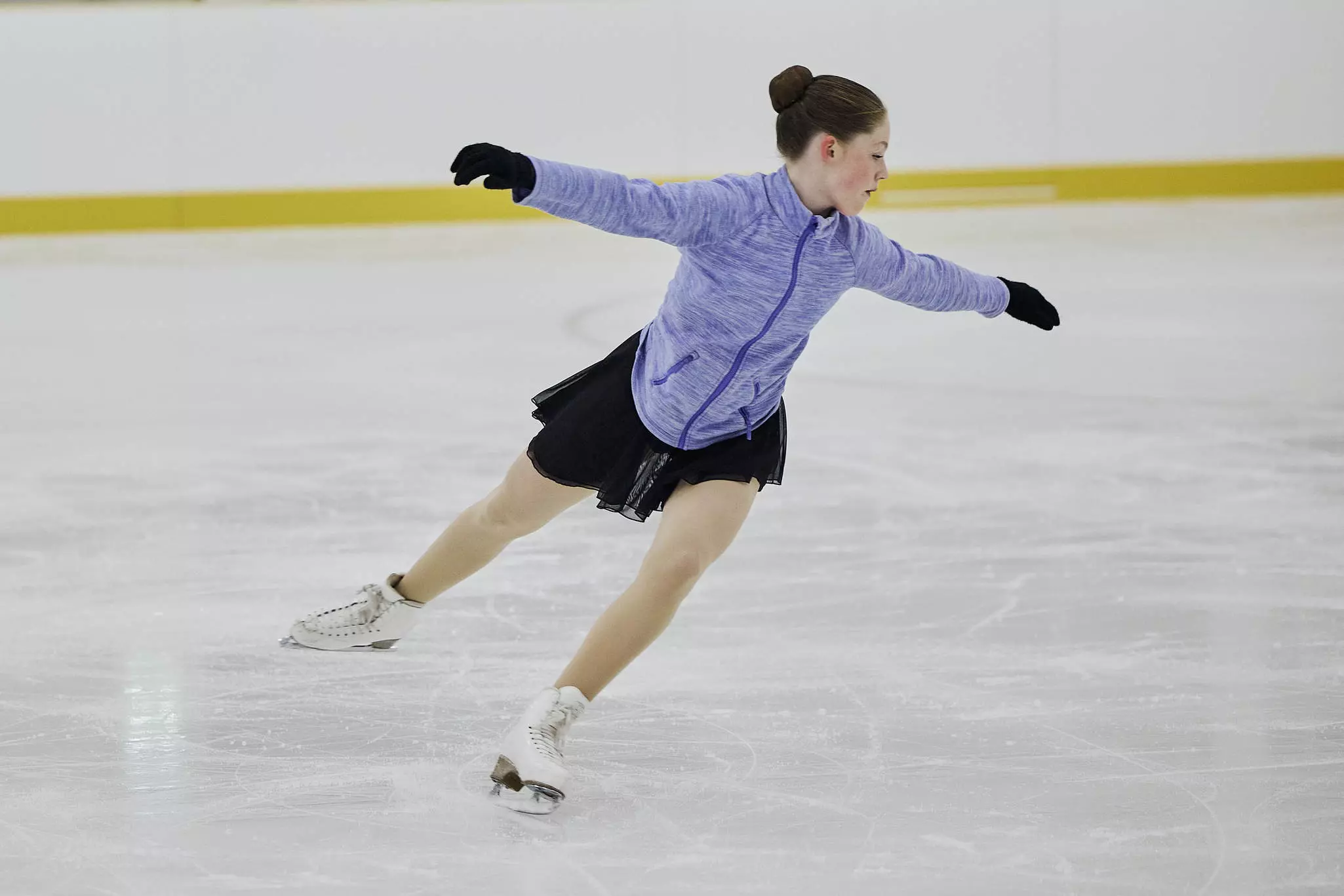 Girl ice skating.