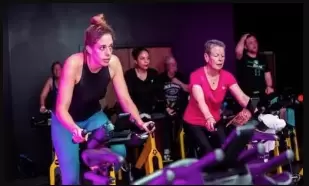 Women in a group cycle class