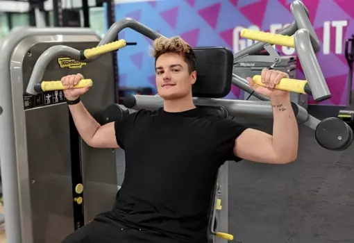 Guy using gym equipment