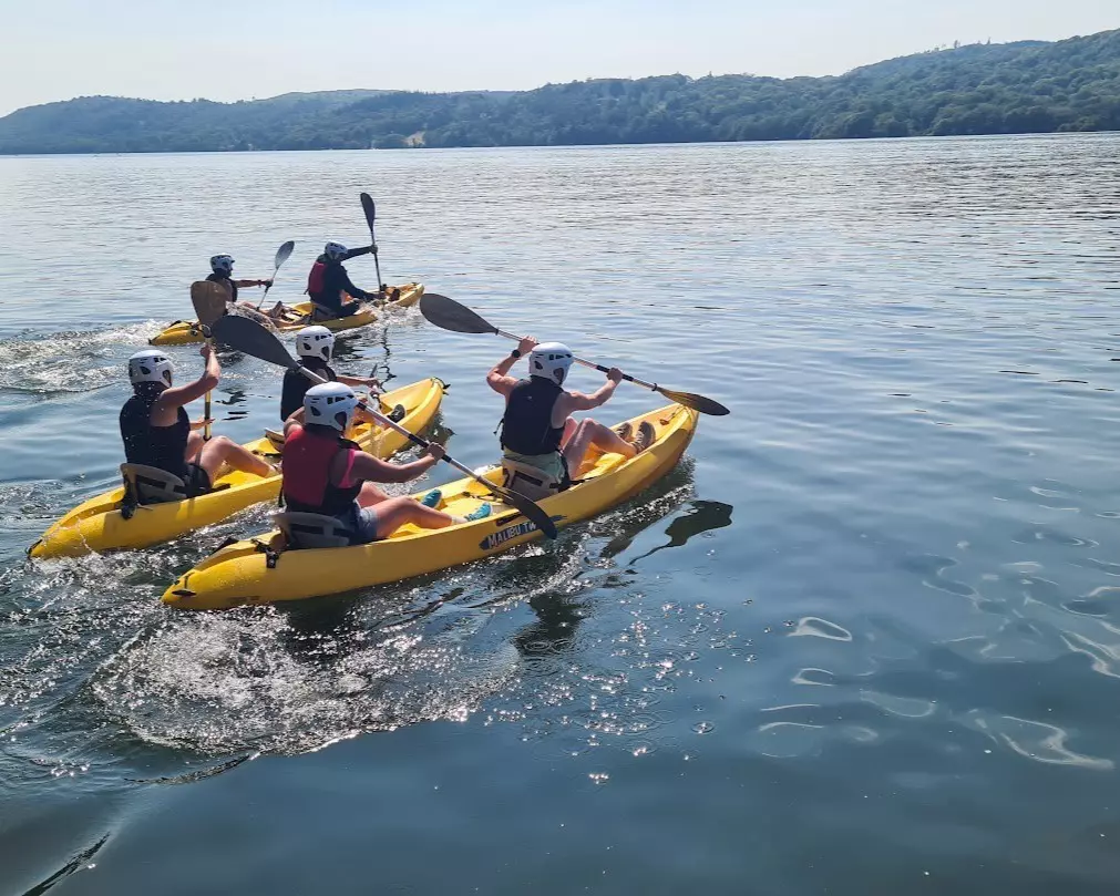 Corporate team on kayaks in the lake