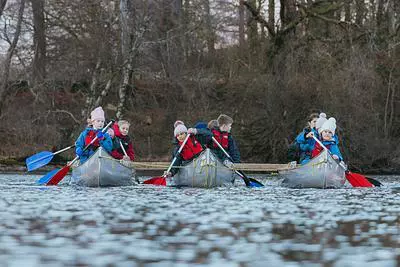 Group of children canoeing on a lake