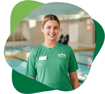 Woman standing and smiling in front of the pool.