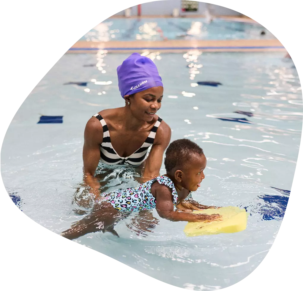 Woman with a child in the pool.