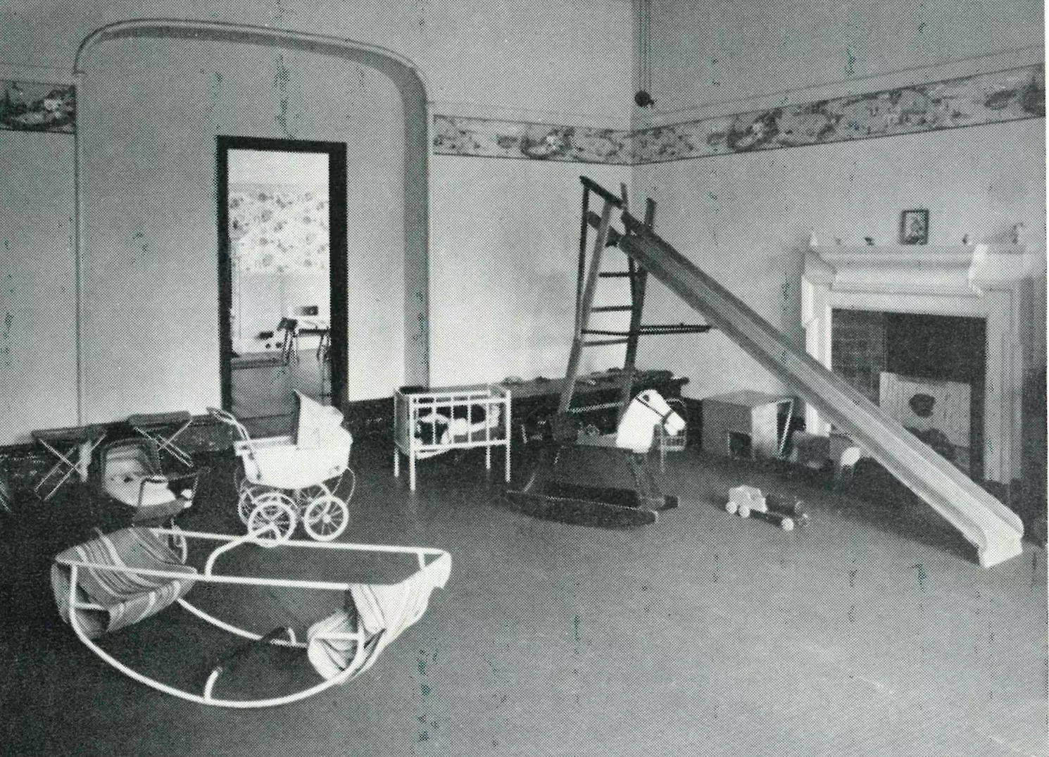 Old-fashioned playroom with toys, slide, and rocking horse.