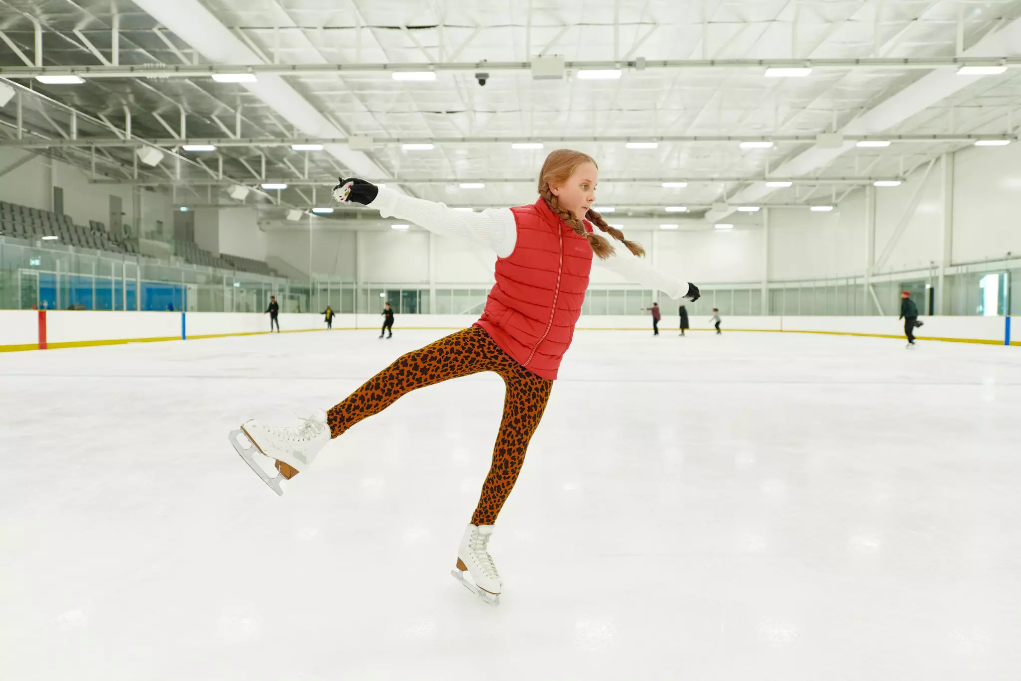 Young woman on an ice rink, iceskating