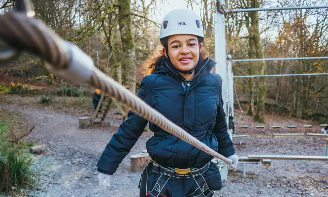 Girl doing rope challenge.
