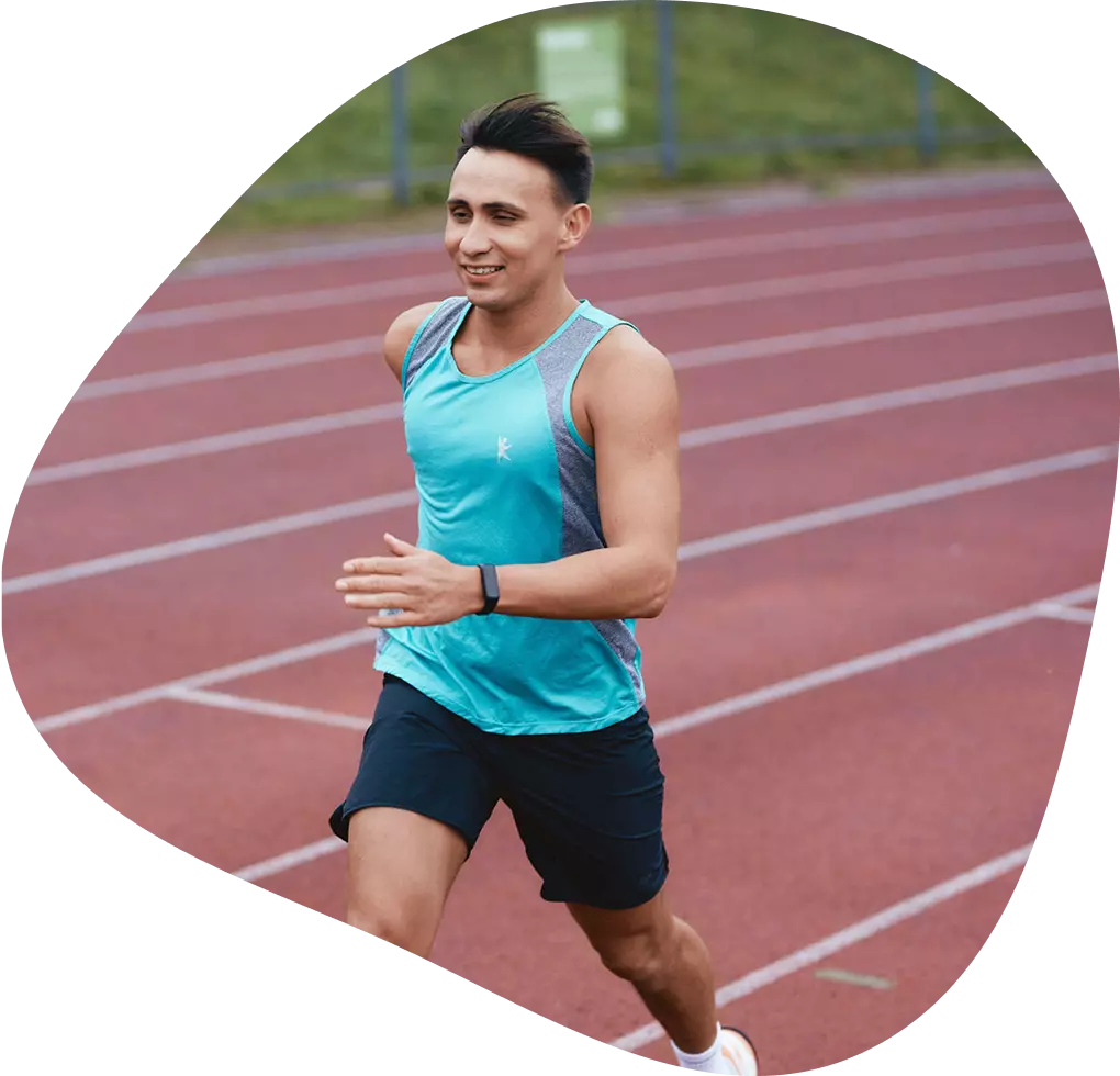 Man running on athletic track.