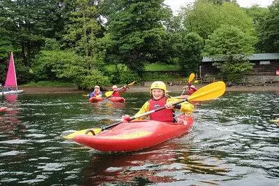 Group of children in kayaks on a lake
