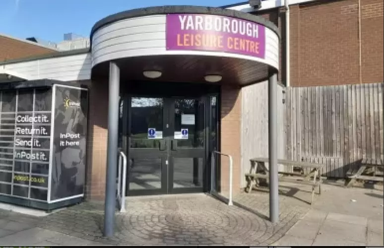 Entrance to Yarborough Leisure Centre with seating area and parcel locker nearby.