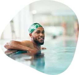Man smiling on the pool. 