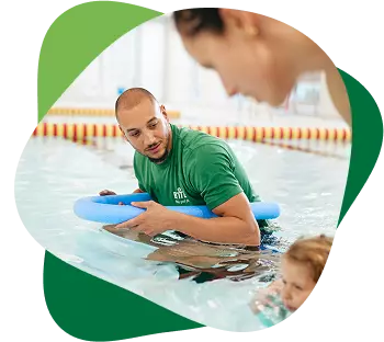 Swimming instructor supporting a child during a pool lesson.