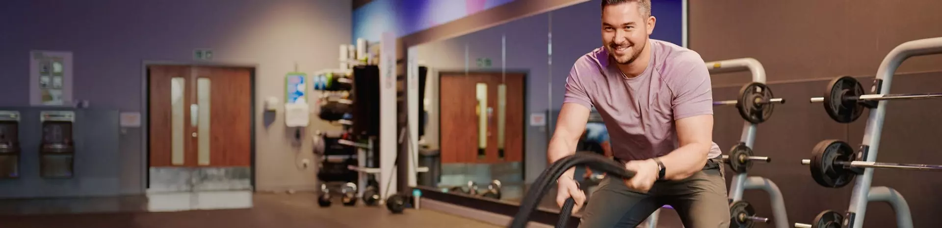 Man using ropes in the gym