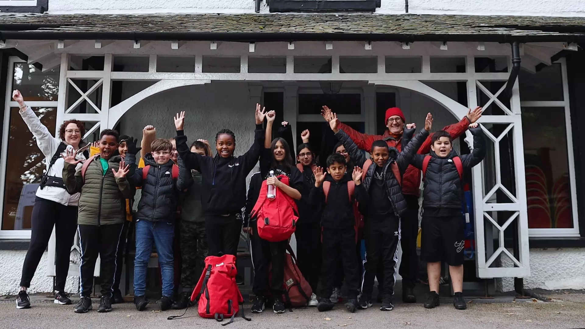 children raising their hands