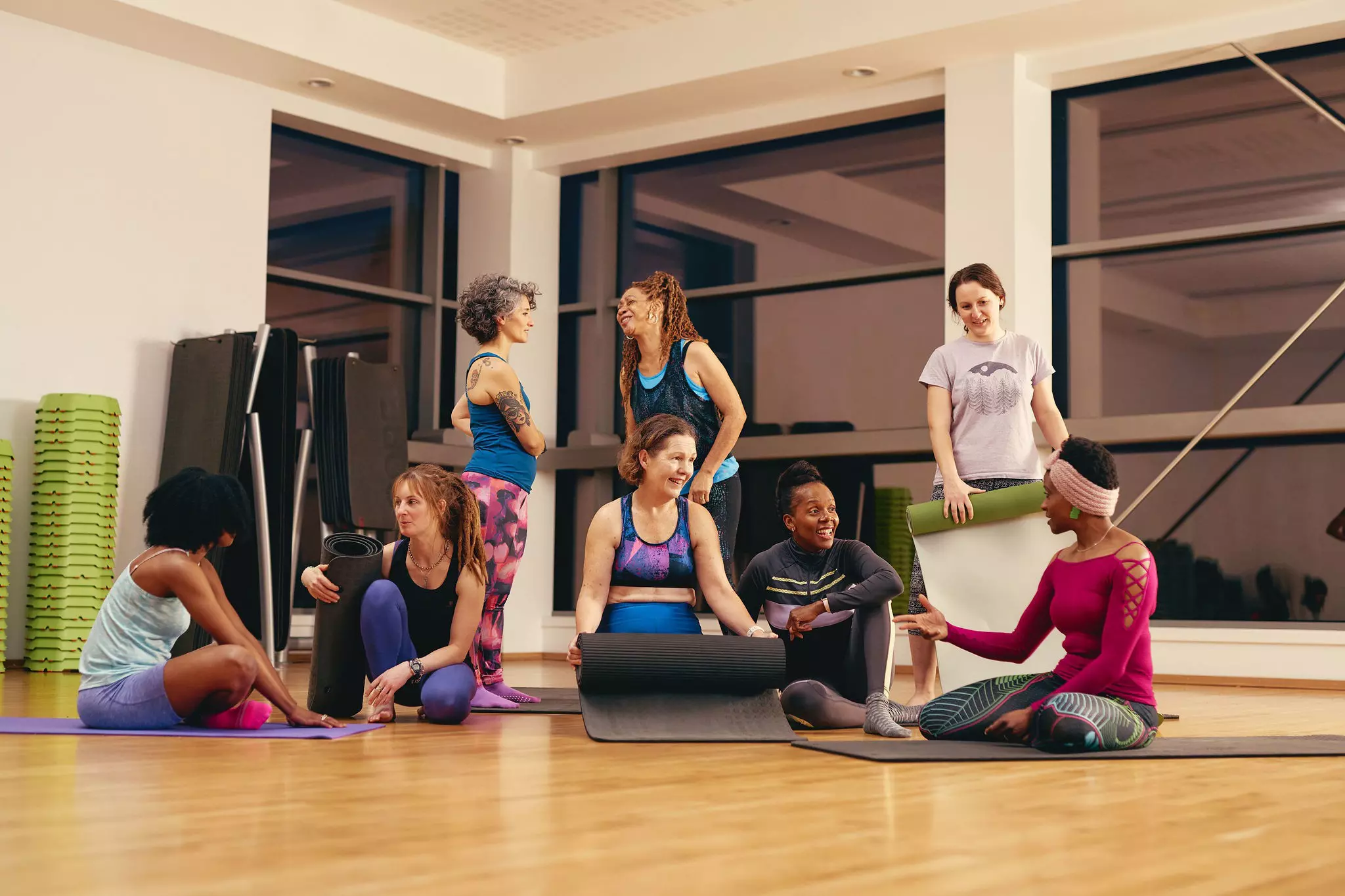 People chatting after fitness class.