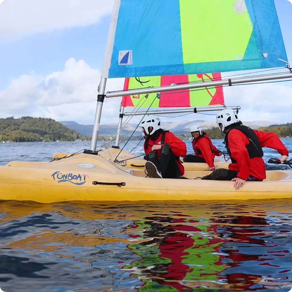 Children sailing on lake windermere at Ghyll Head.