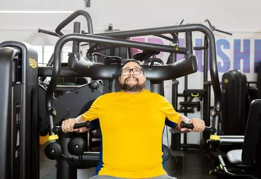 Man using weights machine