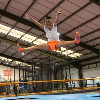 child bouncing on a trampoline